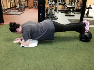 Working out the core by doing the plank